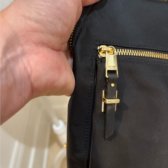 TUMI crossbody sling travel bag Great condition Black gold trim no odors/ tears - Picture 7 of 13